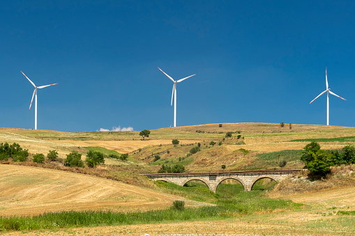 Wind turbine , landscape, alternative energy, environmental conservation.  Beauty in nature, blue evening sky, Lugo province, Galicia, Spain.