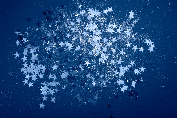 istock Sparkling background with bokeh made of Classic Blue color. 1202459081
