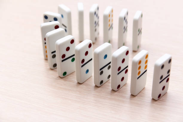 istock white dominoes stand in a row on a light surface, close-up 1202459746