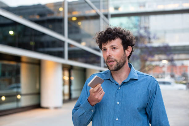 istock Portrait of Argentinian man in 30s talking using his smart phone audio app 1202459967