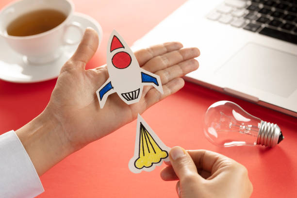 istock Business Person with Startup Rocket 1202460102
