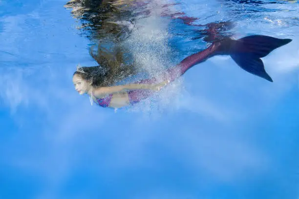 "Play fashion junior", girl in mermaid costume wearing poses underwater, Odessa, Ukraine