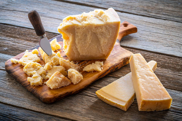 istock Parmesan Reggiano cheese on cutting board 1202462215