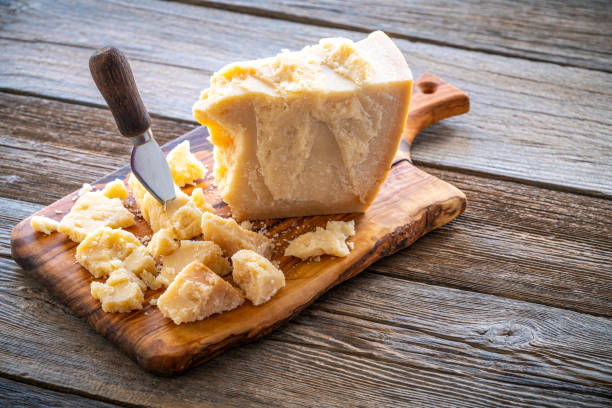 istock Parmesan Reggiano cheese on cutting board 1202462252