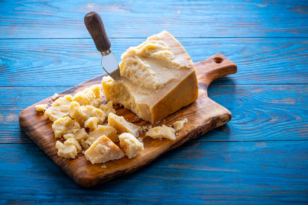 istock Parmesan Reggiano cheese on cutting board 1202462878
