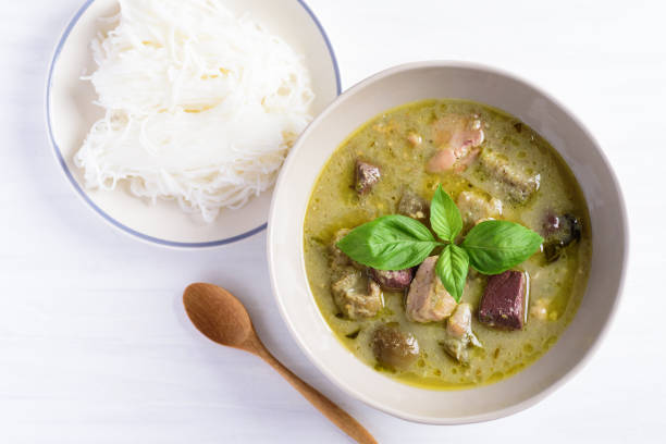 istock Thai green curry chicken and rice noodles 1202463742