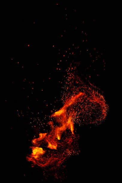 istock Blazing fire and sparks isolated on black background 1202464571