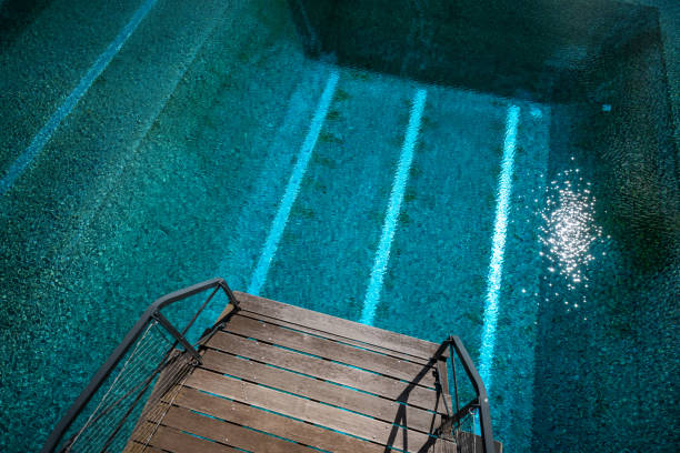 istock diving tower in a swimming pool from above, Germany 1202464775