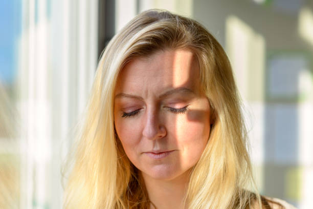 istock Preoccupied worried woman looking down 1202464848