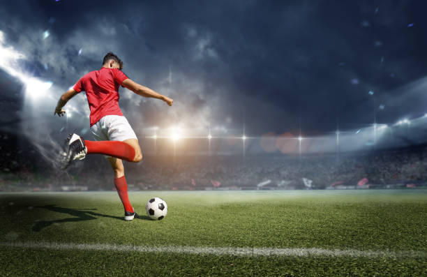 Football player in the stadium An imaginary stadium is modelled and rendered. soccer stock pictures, royalty-free photos & images
