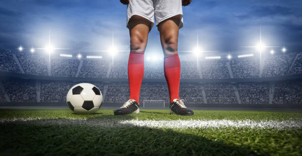 istock Football player in the stadium 1202466346