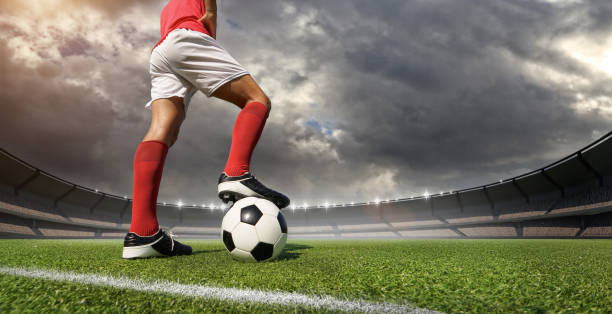 istock football player in the stadium 1202466745