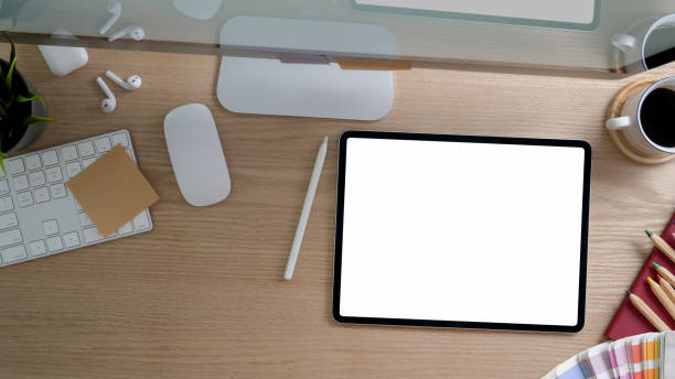 istock Top view of designer workspace with computer, copy space and office supplies on modern rustic desk 1202466991