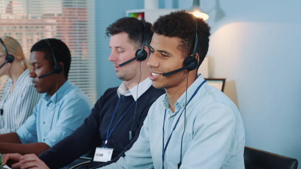 istock Medium shot of black call center agent feeling exhausted and broken-down after telephone call with the client 1202467727