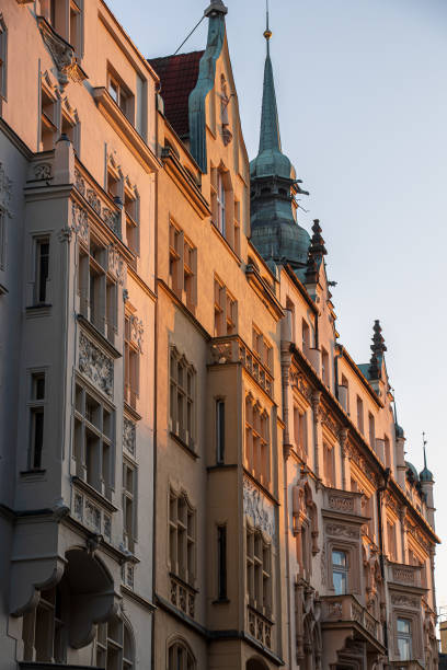 istock Sunlit old buildings in city Prague 1202467989