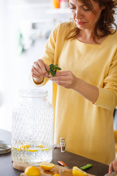 istock Woman preparing aromatic herb for a juice 1202469240