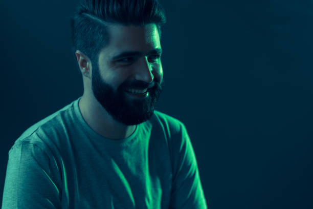 istock Neon portrait of a young attractive man 1202469439