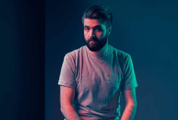 istock Neon portrait of a young attractive man 1202469440