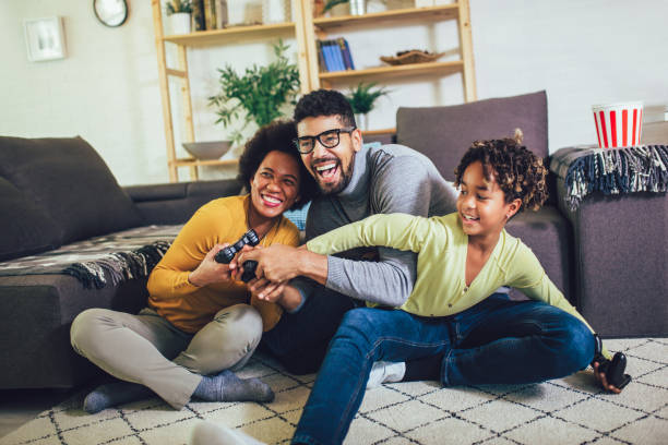 istock Family Playing Video Games Together 1202470779