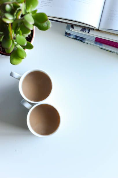 istock Relaxing sofa area with coffee table and hot drink in modern home interior 1202470950
