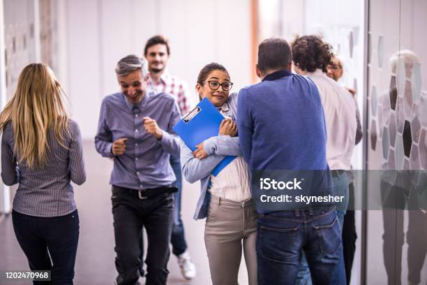 Business People Bumping Into Each Other While Running In A Hallway Stock Photo - Download Image Now