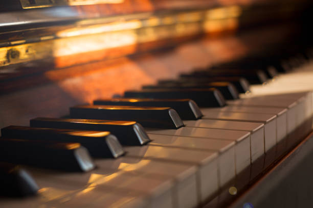 istock old Piano vintage background with selective focus. Warm tone 1202471953