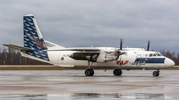 RAF Avia Antonov An-26B RAF Avia Antonov An-26B, YL-RAD, taxiing to stand. Pulkovo International Airport, Saint-Petersburg, Russia. 21 January 2020 antonov an 26 stock pictures, royalty-free photos & images