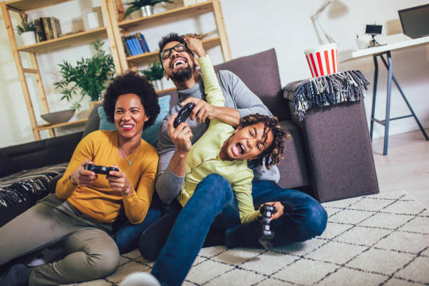 istock Family Playing Video Games Together 1202472741
