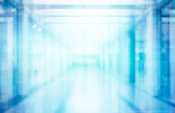 istock Abstract blurred interior of corridor clinic background in blue color , blurry image 1202473639