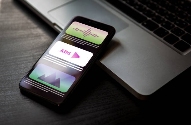 istock Programmatic Advertising - online native targeting ads marketing strategy. Advertising media banner block when viewing a site on a mobile phone screen. 1202473889
