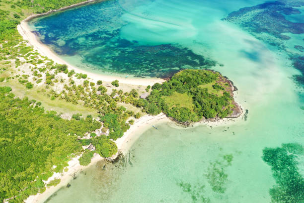 istock A lagoon with a coral reef and a white sandy beach, a view from above 1202474764