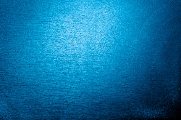 istock Stone table surface. Chalk rubbed out on blue board for background. texture for add text or graphic design.  stone table. Top view with copy space.Classic blue color. Color of the year 2020. 1202475100