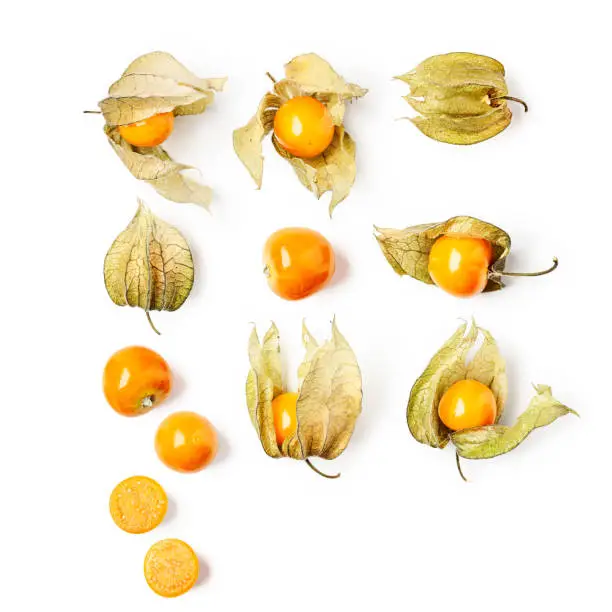 Physalis fruit collection and creative pattern isolated on white background. Healthy eating and dieting food concept. Cape gooseberry composition and design elements. Top view, flat lay