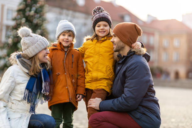 istock Happy young family having fun outdoors during Christmas 1202477200