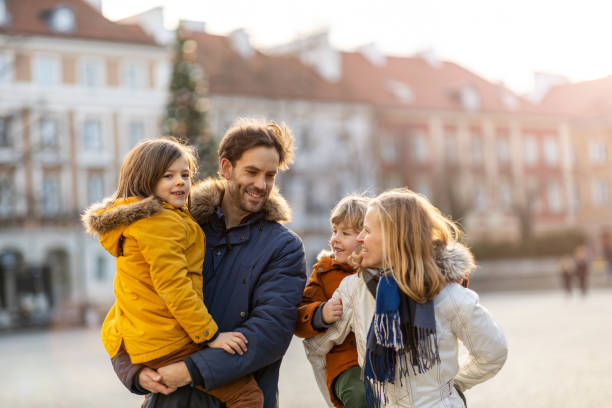 istock Happy young family having fun outdoors during Christmas 1202477308
