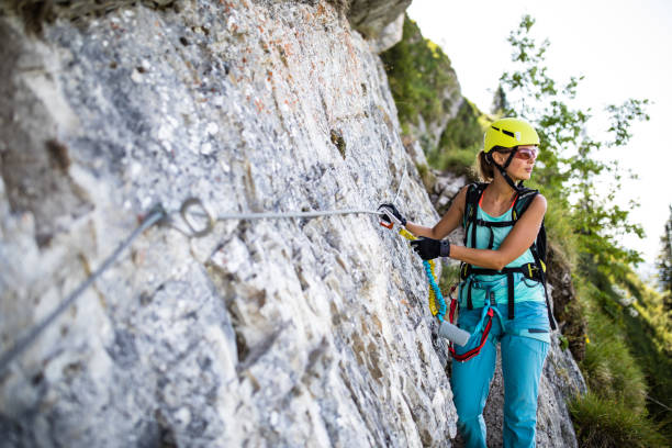istock Pretty, female climber on a via ferrata 1202478182