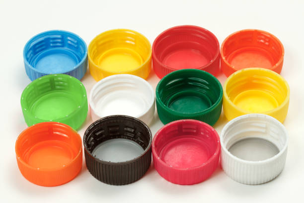 istock Colorful plastic bottle caps on white background 1202478229