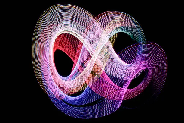 Abstract color shape on black made with light painting or light drawing