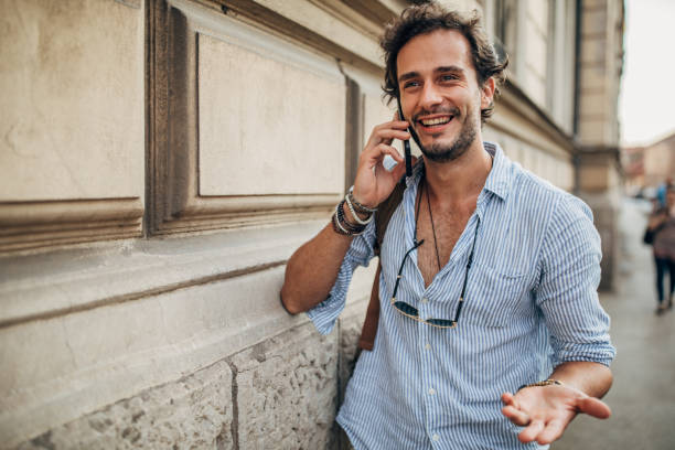 istock One hipster man talking on the smart phone 1202483685