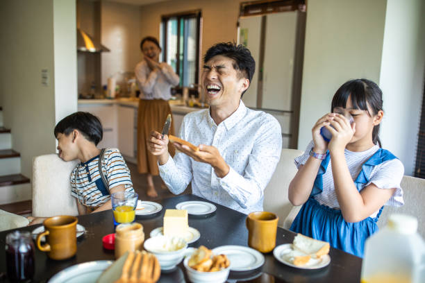 istock Cheerful Taiwanese Family having breakfast at home 1202484859