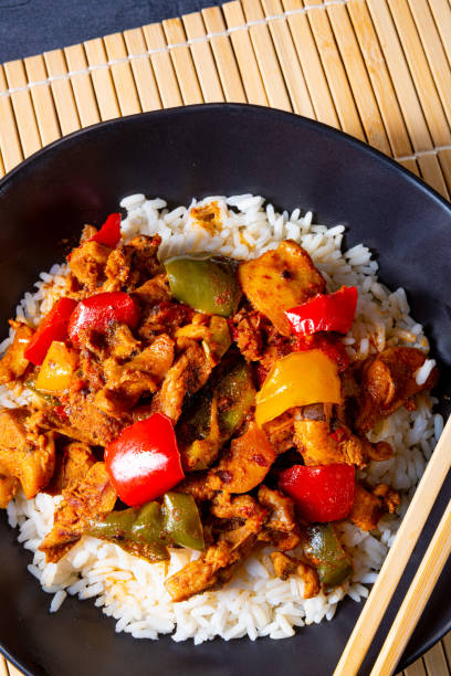 istock Hot roasted chicken with rice and vegetables 1202484889