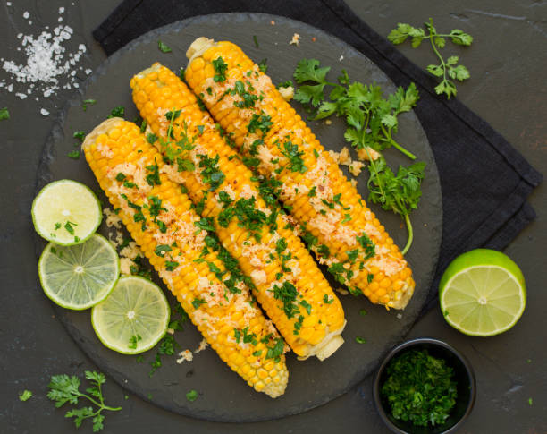 istock Boiled corn with mexican spices, butter, cilantro. 1202485224