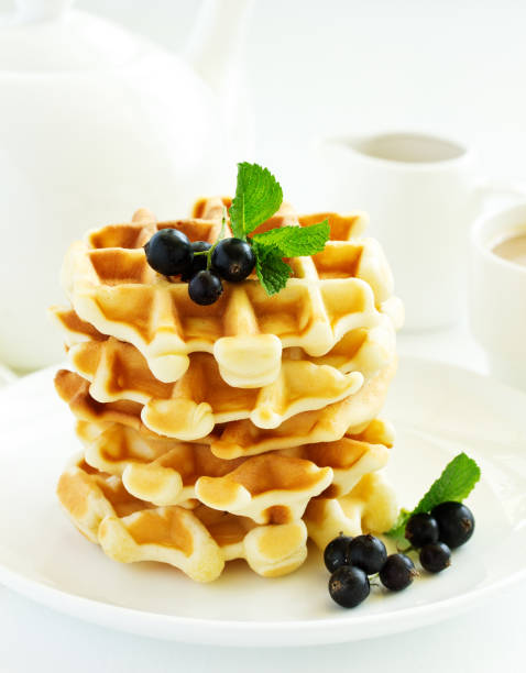 istock Homemade waffles with a sprig of currants. White background. 1202485769