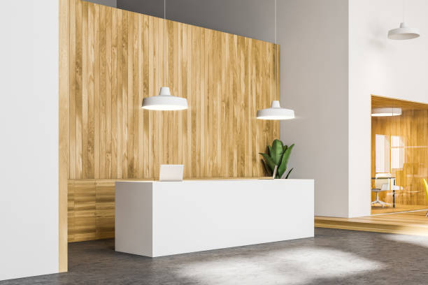 istock White reception desk in bright wooden office 1202487752