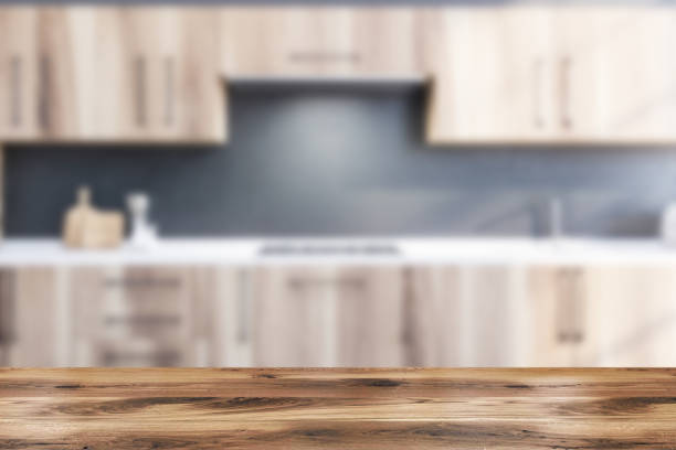 istock Table in blurry gray kitchen with countertops 1202488742