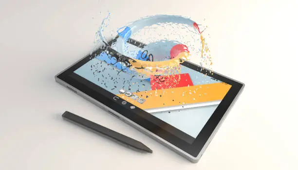 tablet with a vortex of paint on the screen over white surface