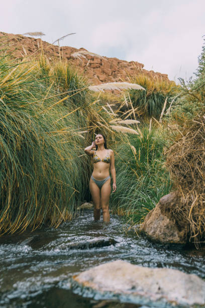 istock Woman in hot spring in Atacama desert 1202489506