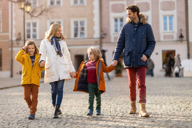 istock Affectionate young family enjoying their day in a city 1202491152