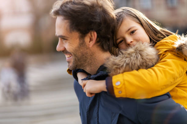 istock Dad and little son hugging outdoors 1202491799