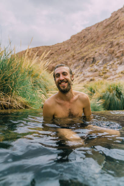istock Man in hot spring in Atacama desert 1202491965